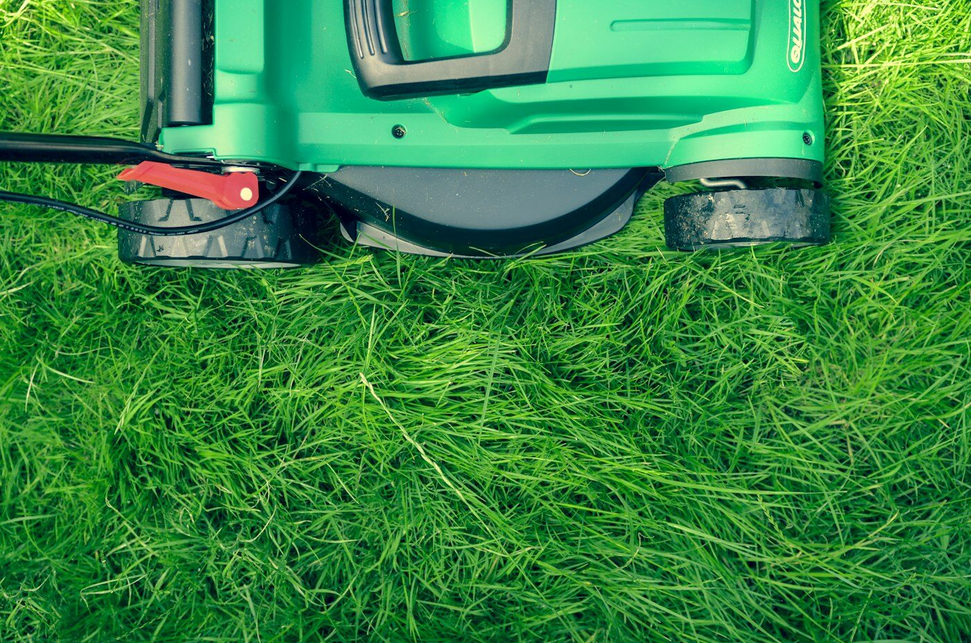 Lawn mower on freshly cut grass