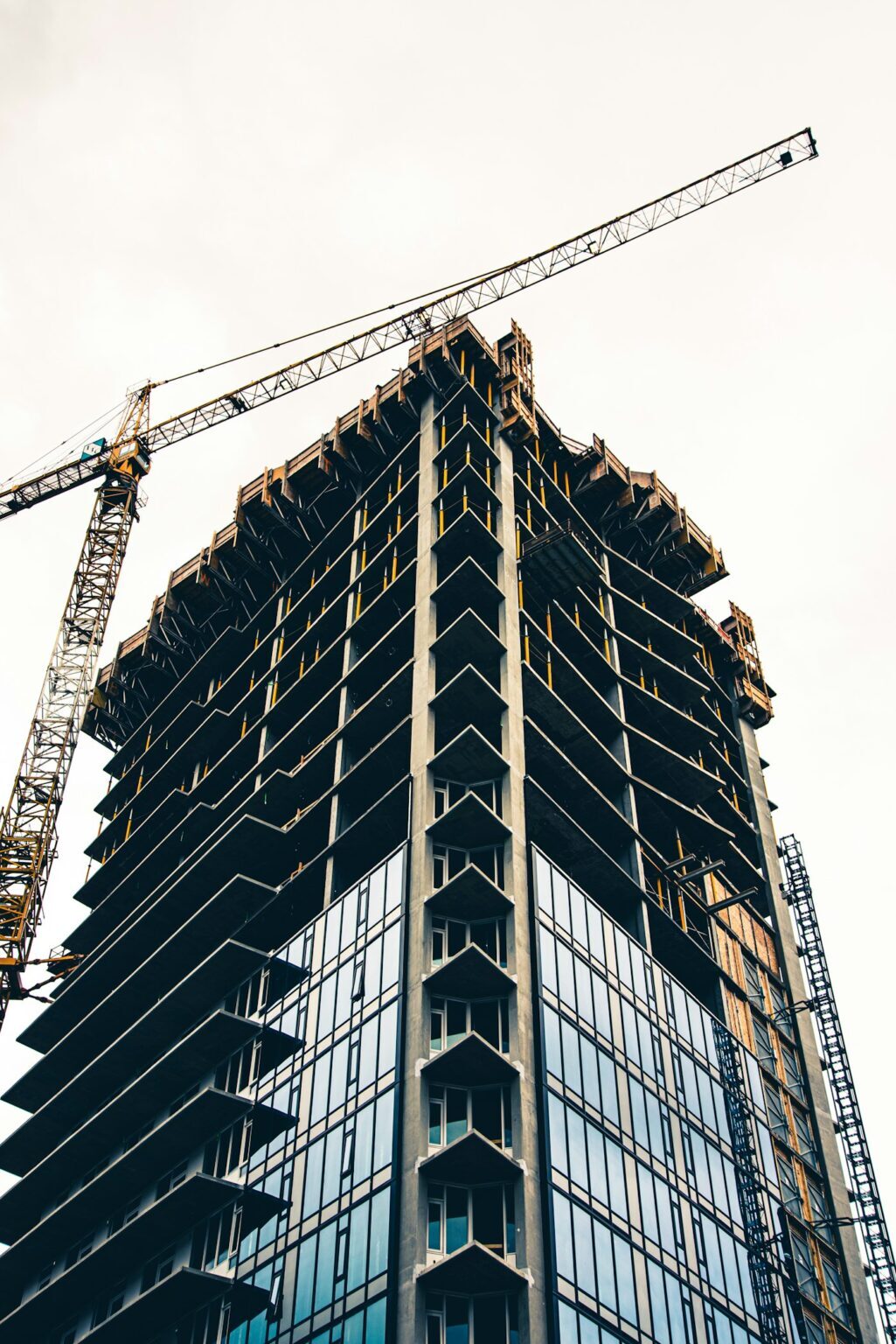Concrete frame of the residence with a tower crane
