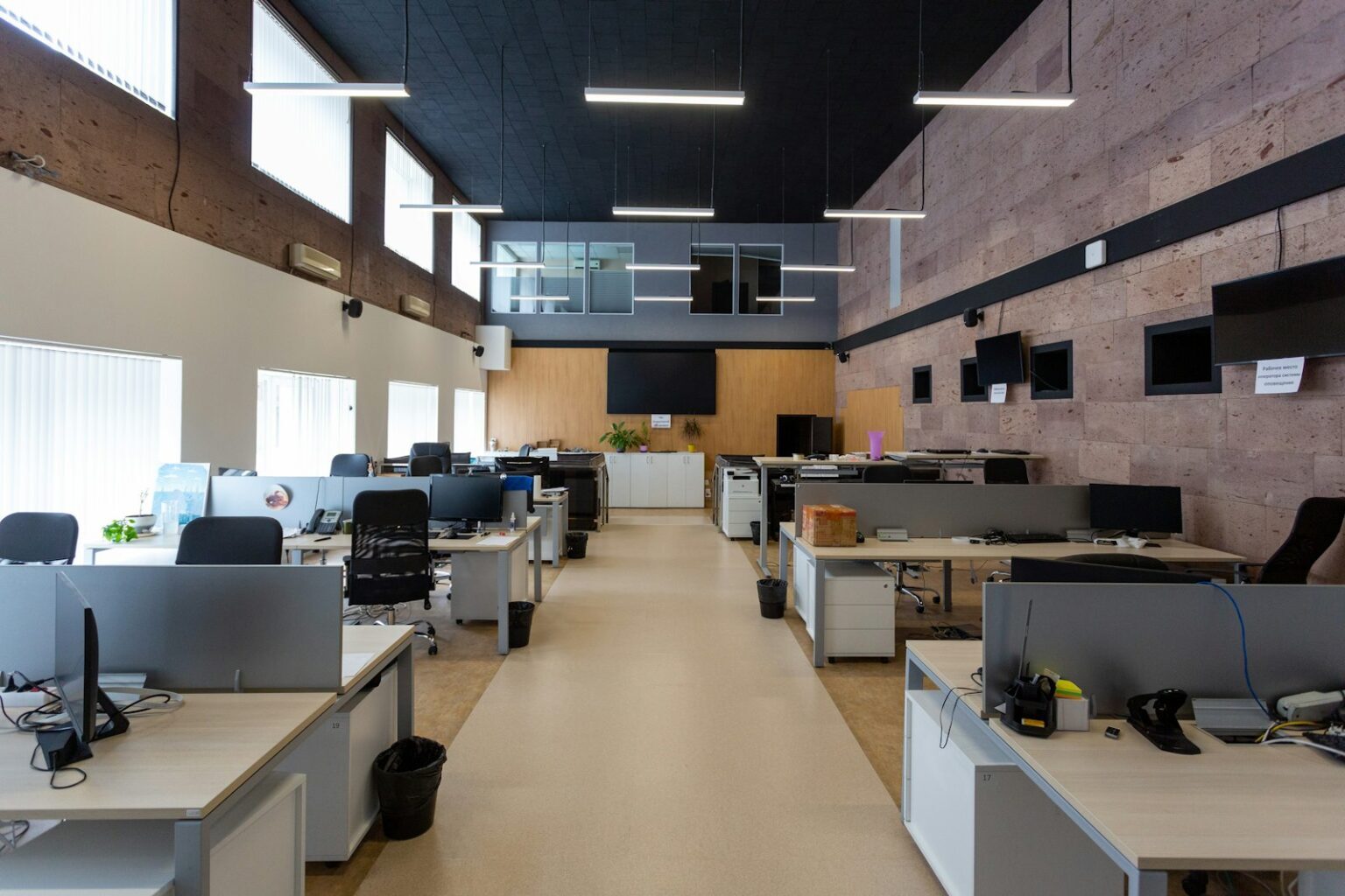 Refurbished open-plan office with rows of desks