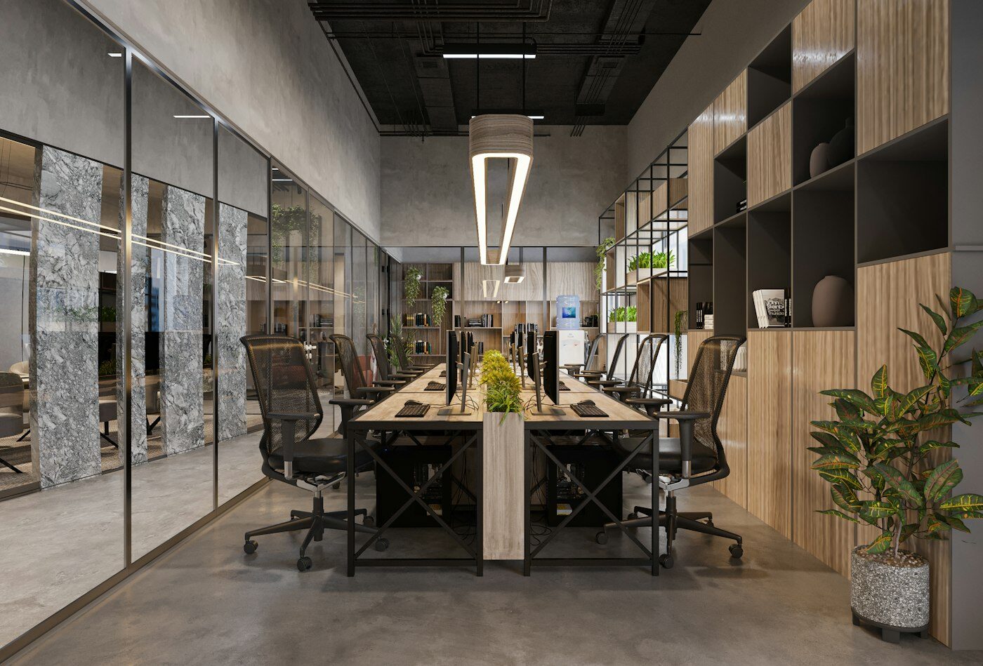 Open-plan workspace with long desks, shelving and pendant lighting